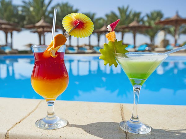 Cocktails on the side of a pool